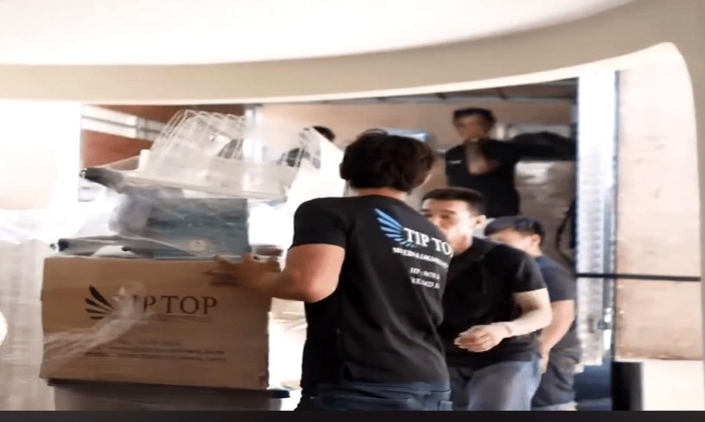 movers and storage company Singapore crew loading wrapped furniture into lorry